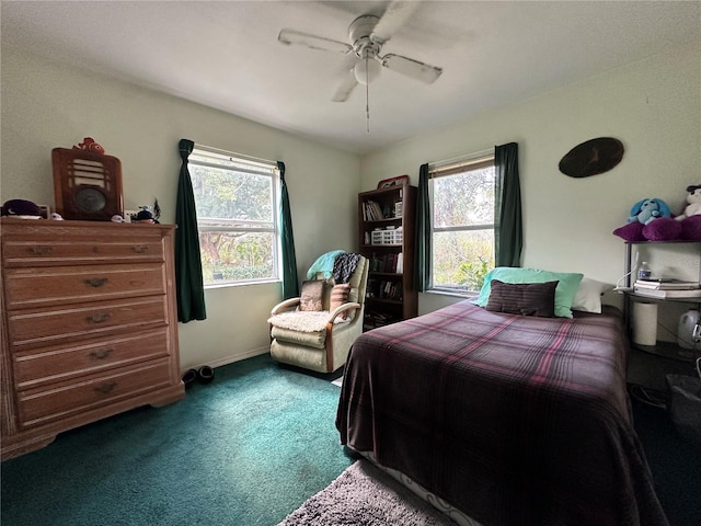 bedroom featuring baseboards, carpet floors, and ceiling fan