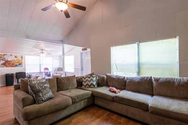 living room with high vaulted ceiling, wood finished floors, and ceiling fan