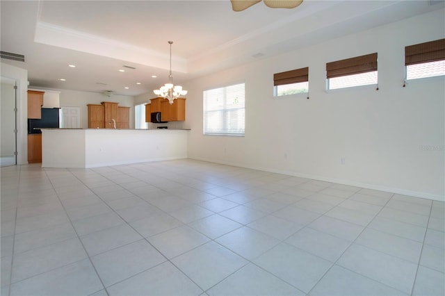 unfurnished living room featuring visible vents, recessed lighting, a raised ceiling, and baseboards