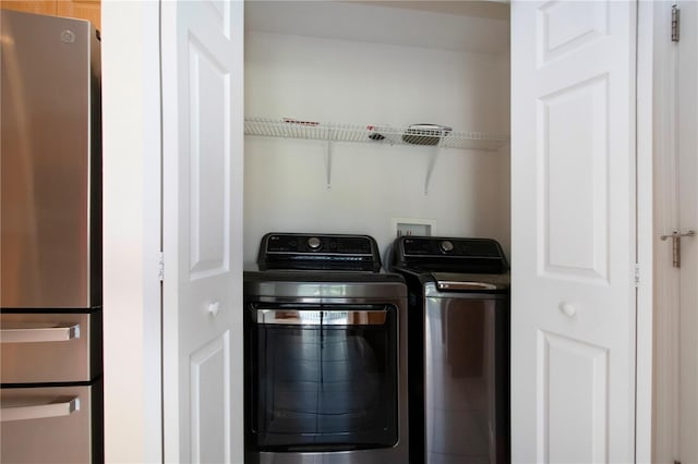 laundry area featuring laundry area and separate washer and dryer