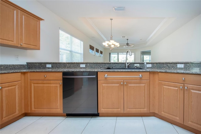 kitchen with visible vents, dark stone countertops, a tray ceiling, a sink, and dishwashing machine