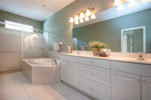 bathroom featuring tile patterned floors, a garden tub, a sink, double vanity, and tiled shower