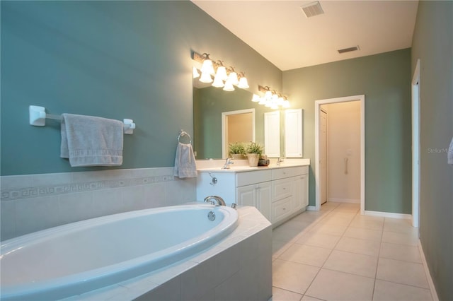 bathroom with tile patterned flooring, visible vents, a bath, and a sink