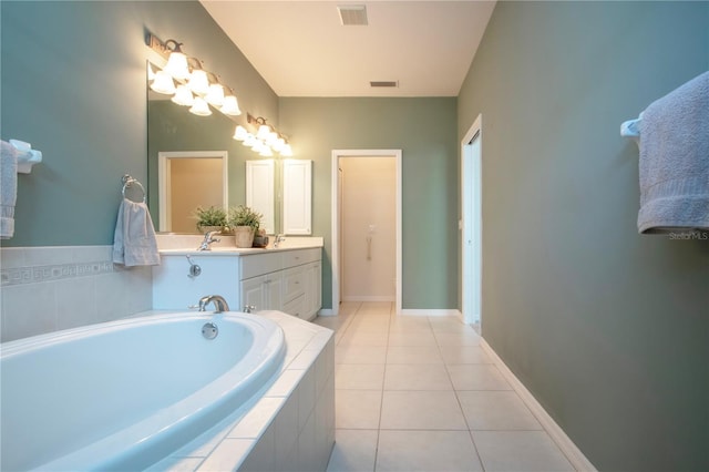 bathroom with vanity, tile patterned floors, a bath, and visible vents