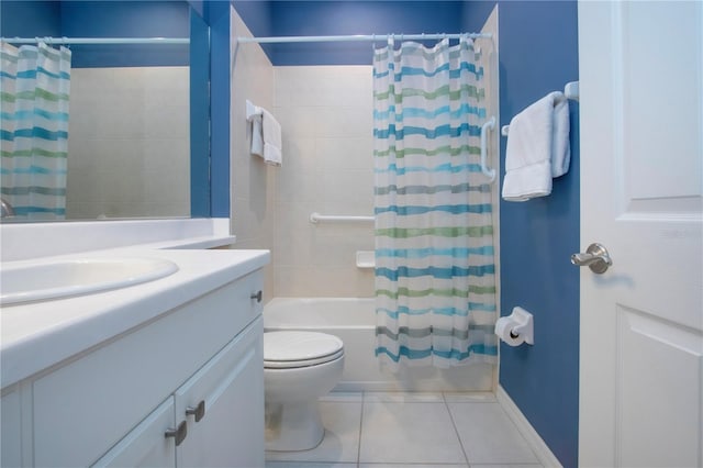 bathroom with tile patterned floors, shower / tub combo with curtain, toilet, baseboards, and vanity