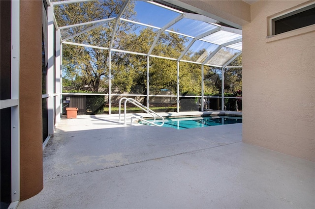 pool featuring a lanai and a patio area