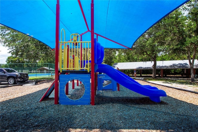 communal playground featuring fence