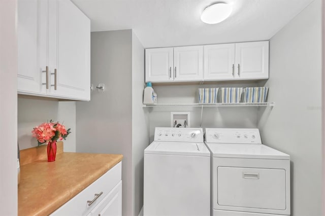 laundry area featuring cabinet space and washing machine and dryer