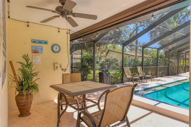 exterior space featuring a swimming pool and a ceiling fan