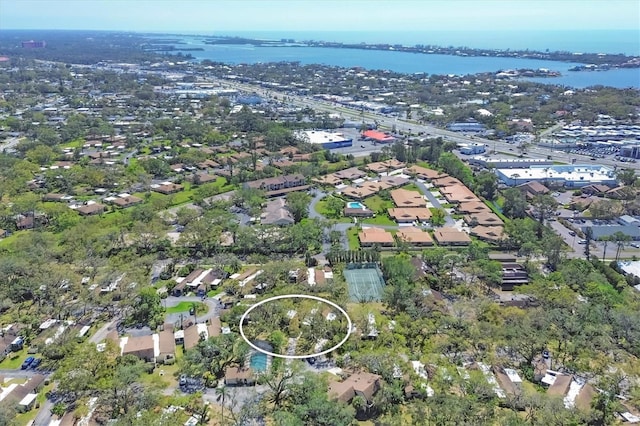 drone / aerial view with a residential view and a water view