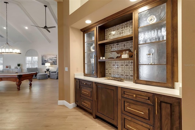 bar featuring lofted ceiling with beams, decorative light fixtures, light wood-style floors, pool table, and ceiling fan