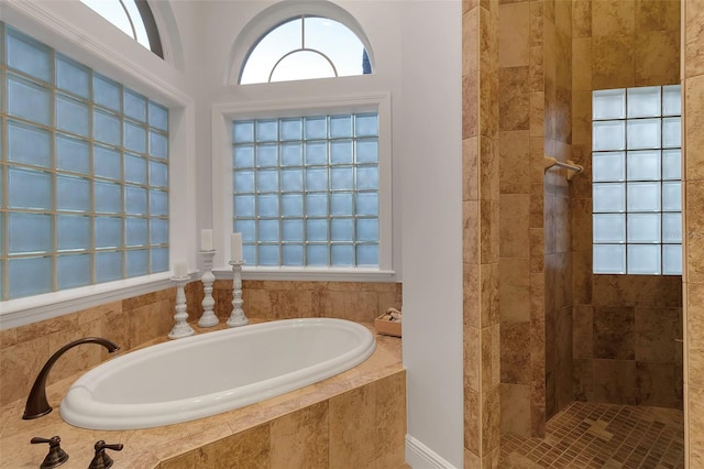 bathroom with a garden tub and walk in shower