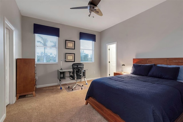 carpeted bedroom with baseboards and ceiling fan