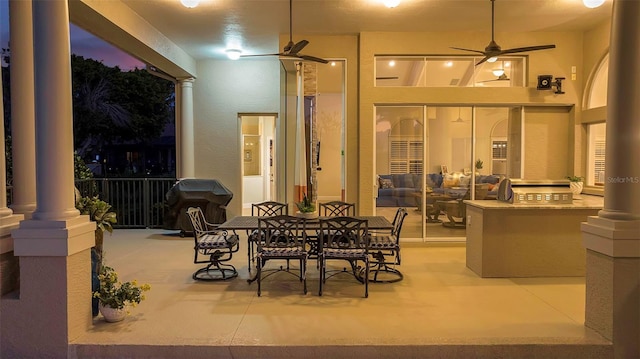 view of patio / terrace featuring outdoor dining area and a ceiling fan