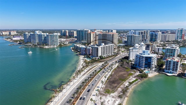 aerial view featuring a city view and a water view