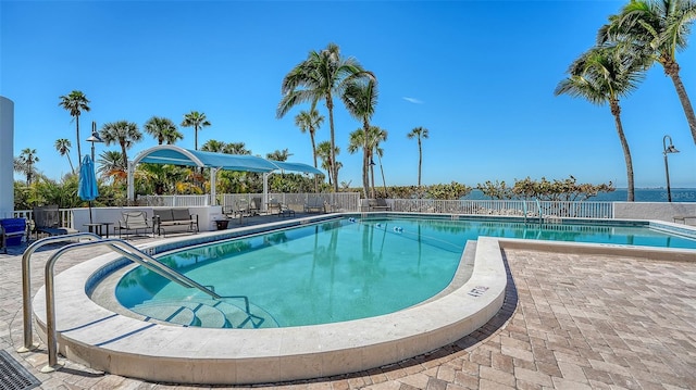 pool featuring a patio and fence