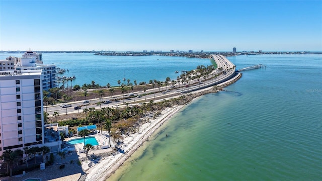 birds eye view of property featuring a view of city and a water view