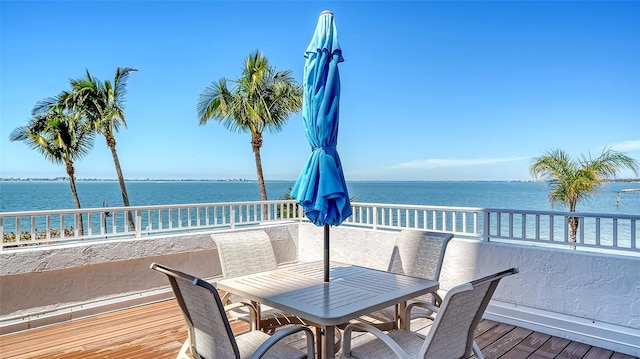 wooden deck featuring a water view