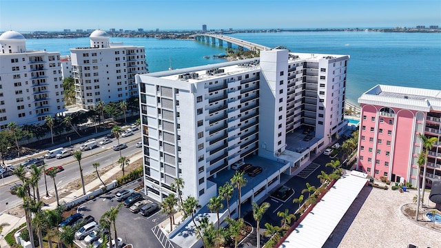 birds eye view of property with a view of city and a water view