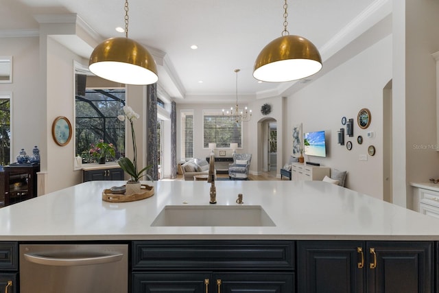 kitchen featuring arched walkways, ornamental molding, light countertops, dishwasher, and open floor plan