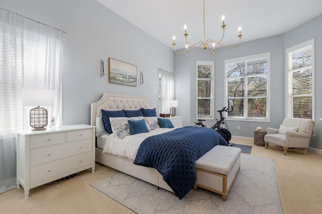 bedroom featuring an inviting chandelier, vaulted ceiling, baseboards, and light carpet