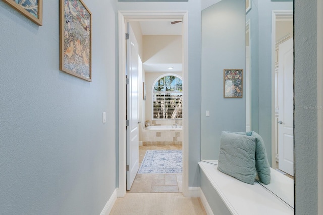 corridor featuring baseboards