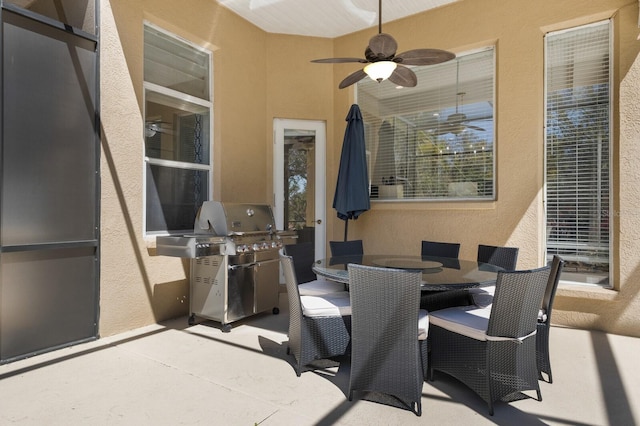 view of patio / terrace featuring grilling area, outdoor dining area, and ceiling fan