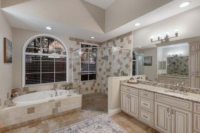 bathroom with vanity, a garden tub, recessed lighting, and a stall shower