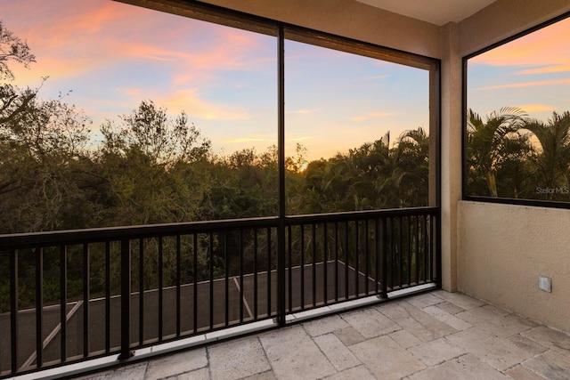 view of balcony at dusk