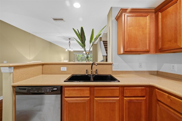 kitchen with stainless steel dishwasher, light countertops, visible vents, and a sink