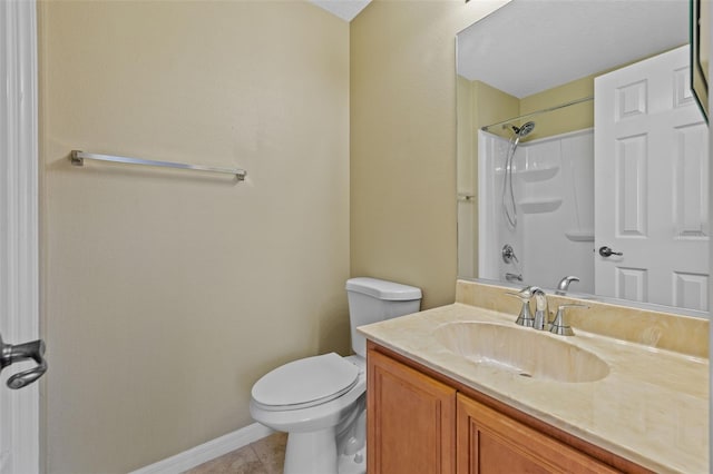 bathroom featuring vanity, tile patterned floors, toilet, and baseboards