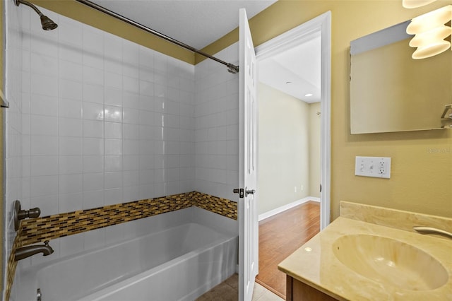 full bathroom with tile patterned flooring, vanity, tub / shower combination, and baseboards