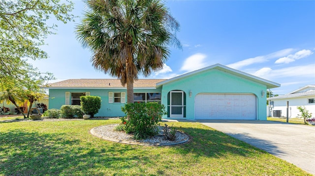 single story home with stucco siding, a front lawn, central AC, concrete driveway, and an attached garage