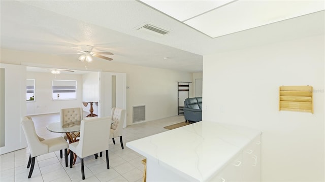 dining room with visible vents and ceiling fan