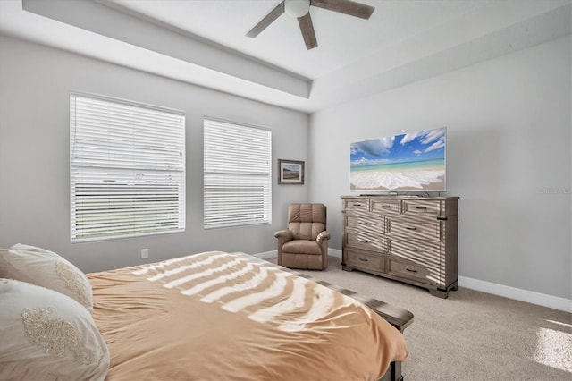 bedroom with light carpet, ceiling fan, and baseboards