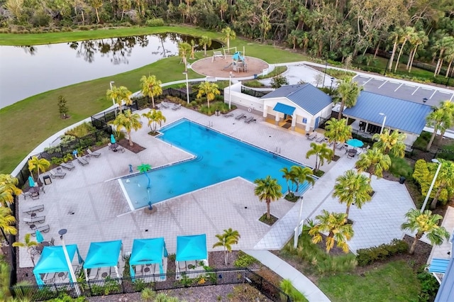 birds eye view of property with a water view