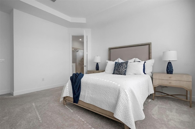 carpeted bedroom featuring baseboards