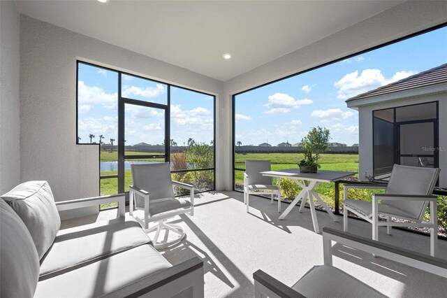 sunroom / solarium featuring a rural view