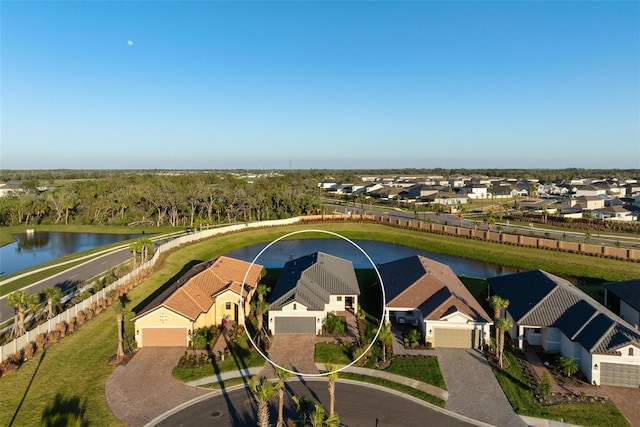 bird's eye view featuring a residential view and a water view