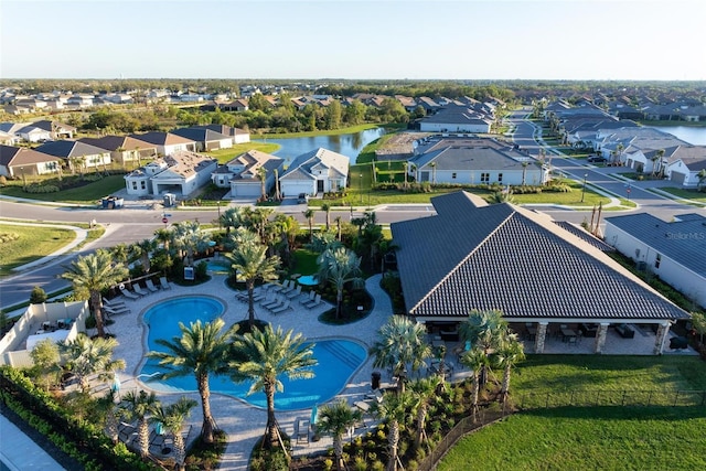 bird's eye view with a residential view and a water view