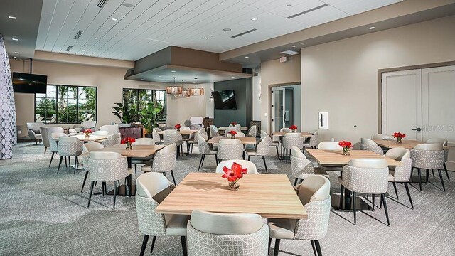 dining room with recessed lighting, visible vents, and light colored carpet