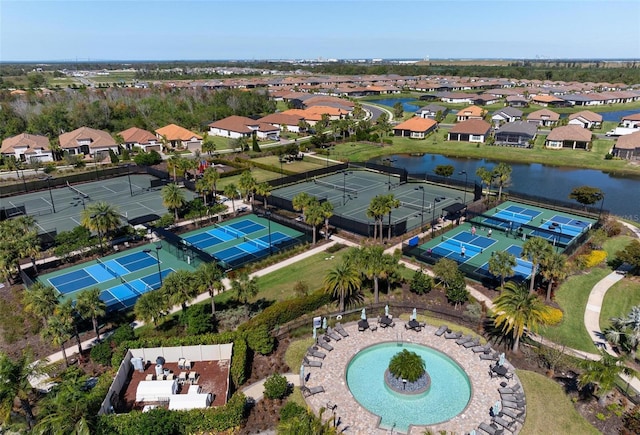 birds eye view of property with a residential view and a water view