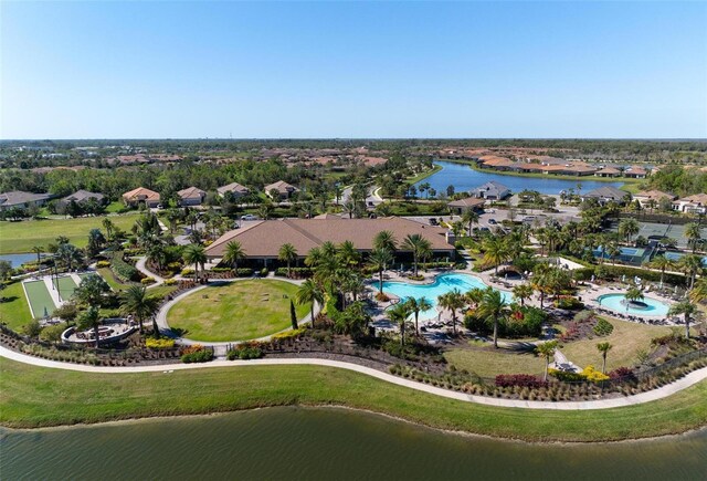 birds eye view of property featuring a residential view and a water view