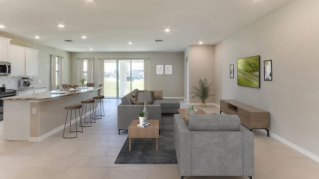 living area featuring light tile patterned flooring, visible vents, recessed lighting, and baseboards