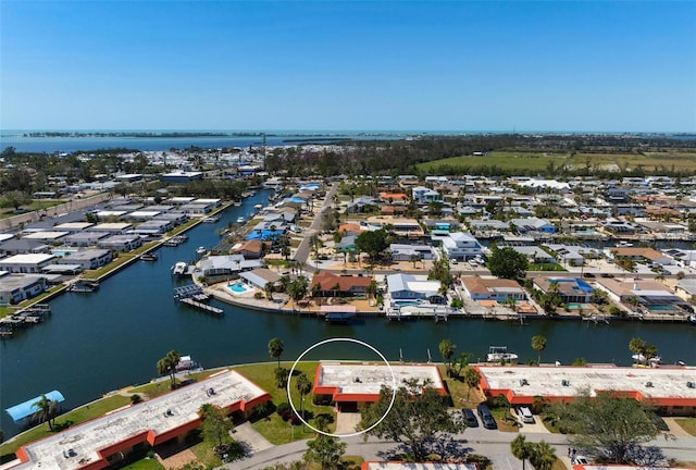 birds eye view of property featuring a residential view and a water view