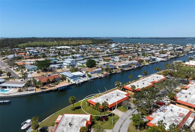 birds eye view of property with a water view and a residential view