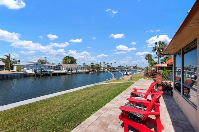 view of patio / terrace with a water view and a dock