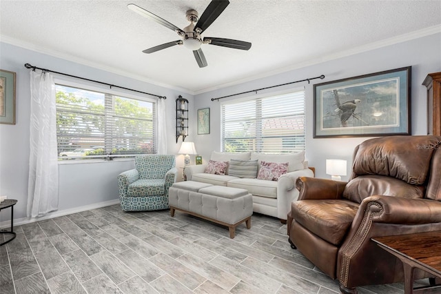 living area with crown molding, a ceiling fan, and a healthy amount of sunlight