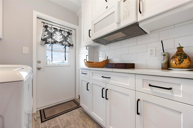 laundry area with cabinet space and washer and clothes dryer