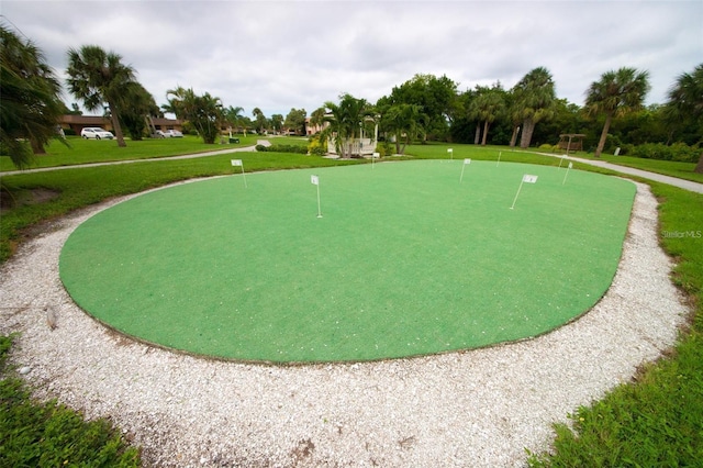 view of property's community featuring a yard